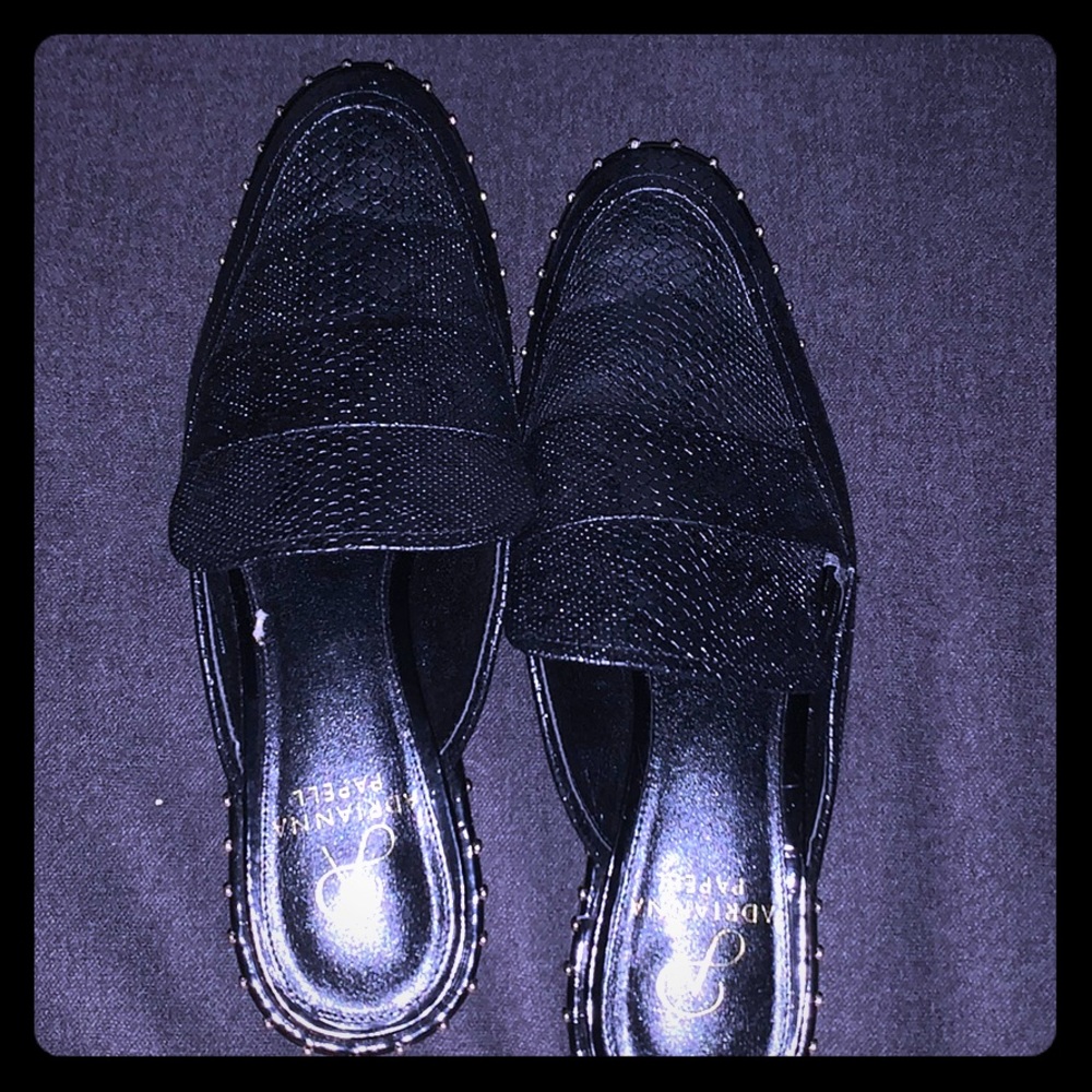 black leather studded mules.